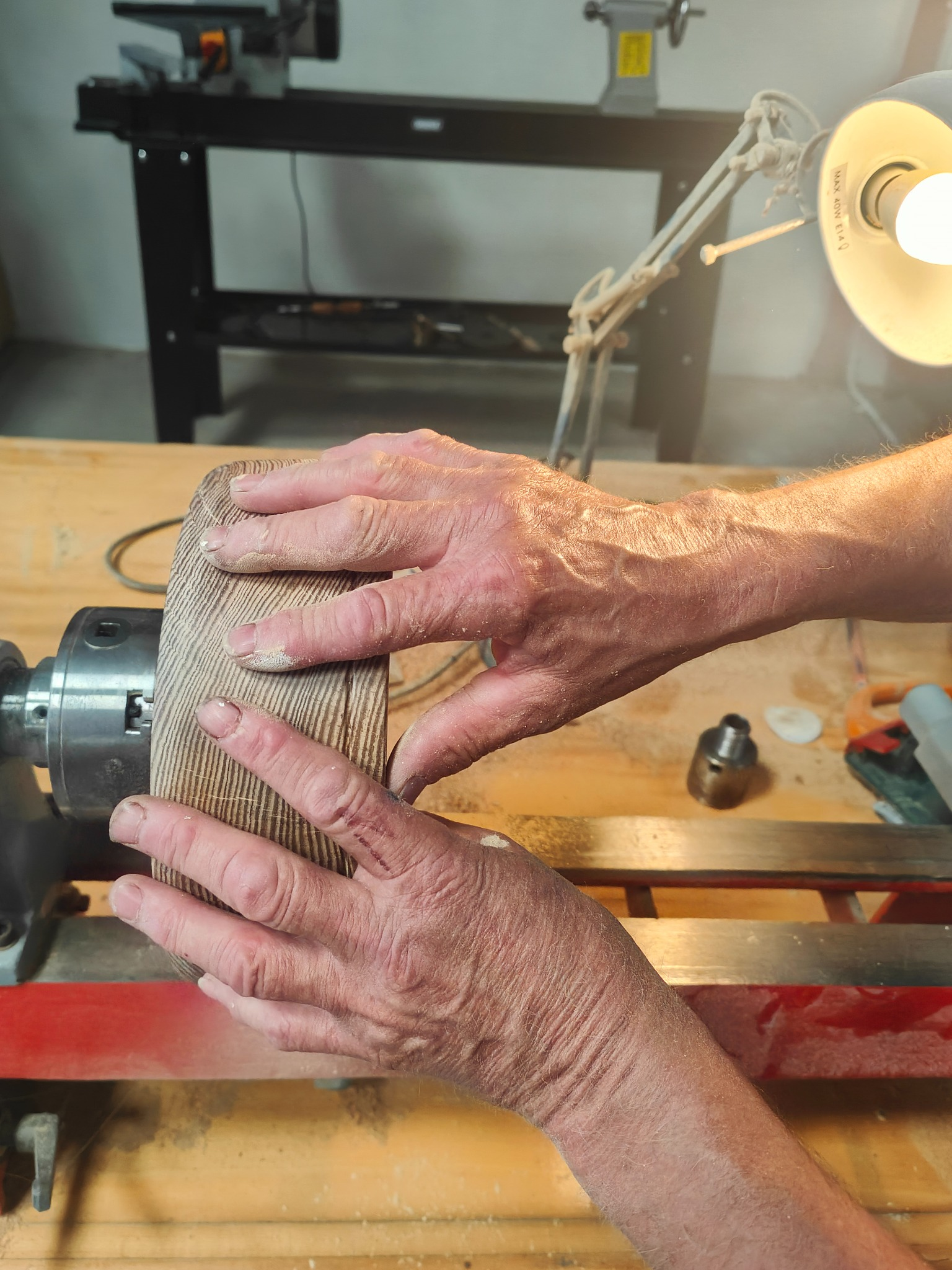Barry Finnegan's hands at the lathe